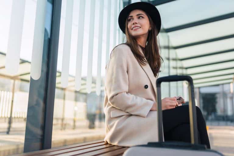 woman sitting at bus stop