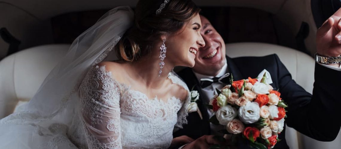 bride and groom in car